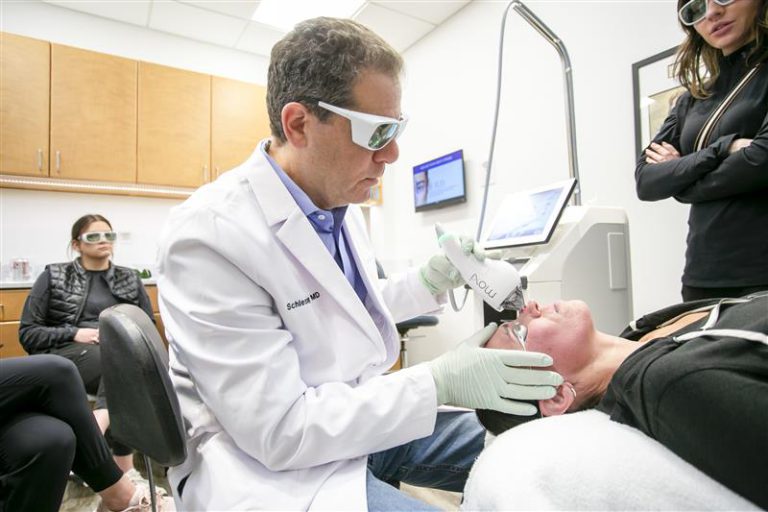 Dr. Joel Schlessinger performing laser treatment