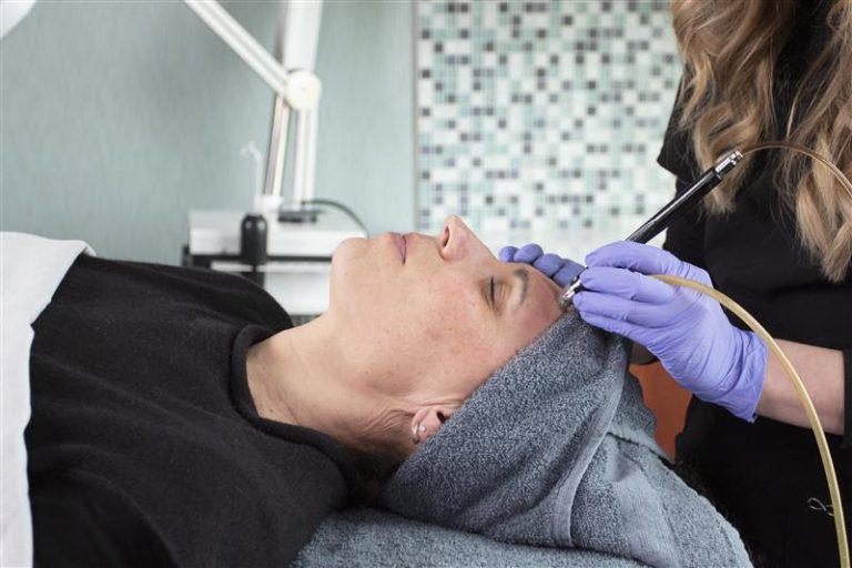 woman receiving a facial at the LovelySkin Spa