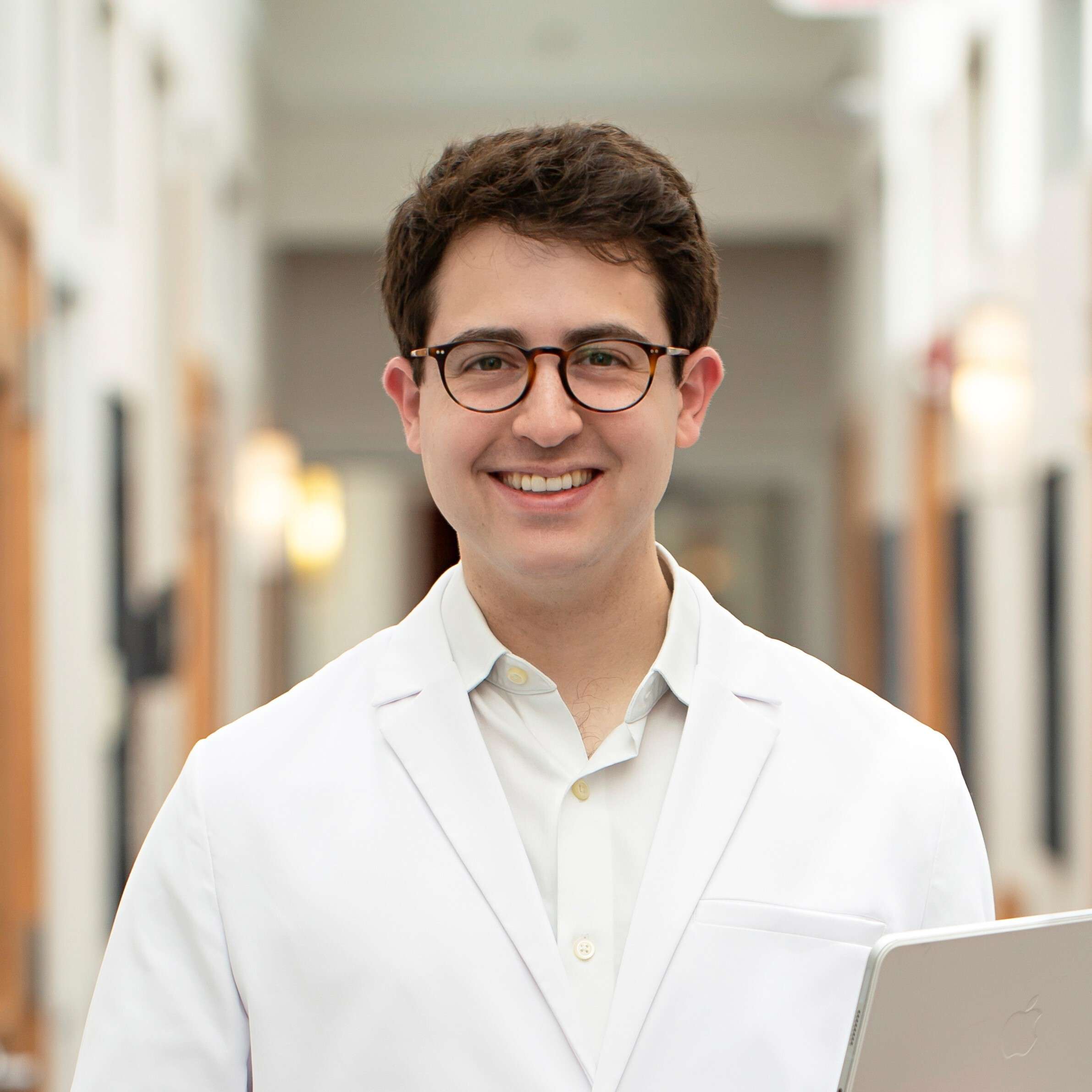 Dr Daniel Standing in Schlessinger MD hallway